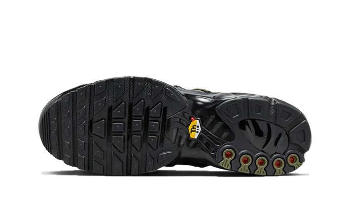 Air Max Plus Utility Black Olive running in a concrete bridge area shoes space - themed running shoes