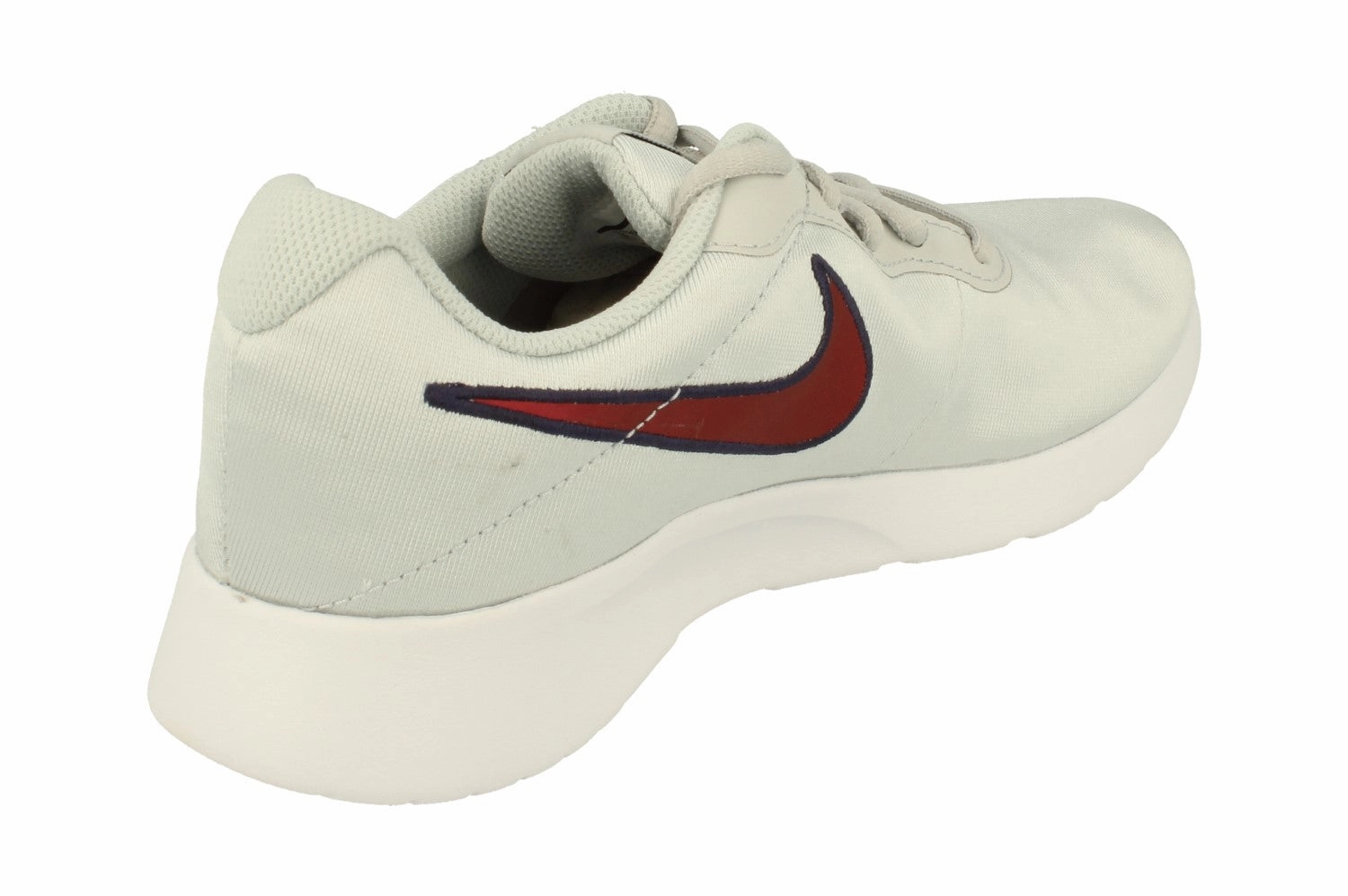 running in a community park shoes Nike Womens Tanjun Se 844908 010