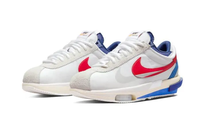 running with knee braces running on a track shoes Cortez 4.0 Sacai White University Red Blue