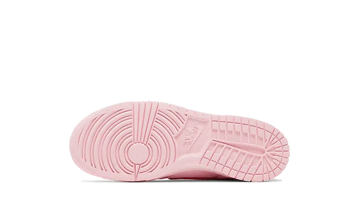 Dunk Low Triple Pink Enfant (PS) running on a track oval