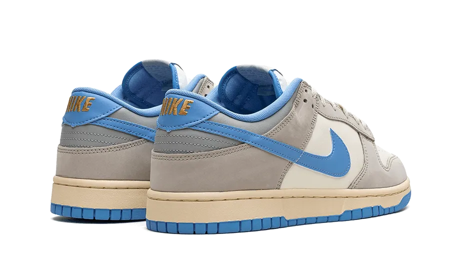 senior running Dunk Low Athletic Department University Blue