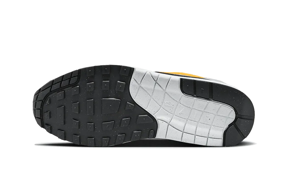 Air Max 1 White University Gold Competitive Edge running in a pier area shoes