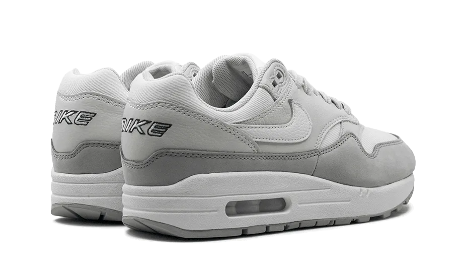 running with a phone high - top footwear Air Max 1 '87 LX Light Smoke Grey