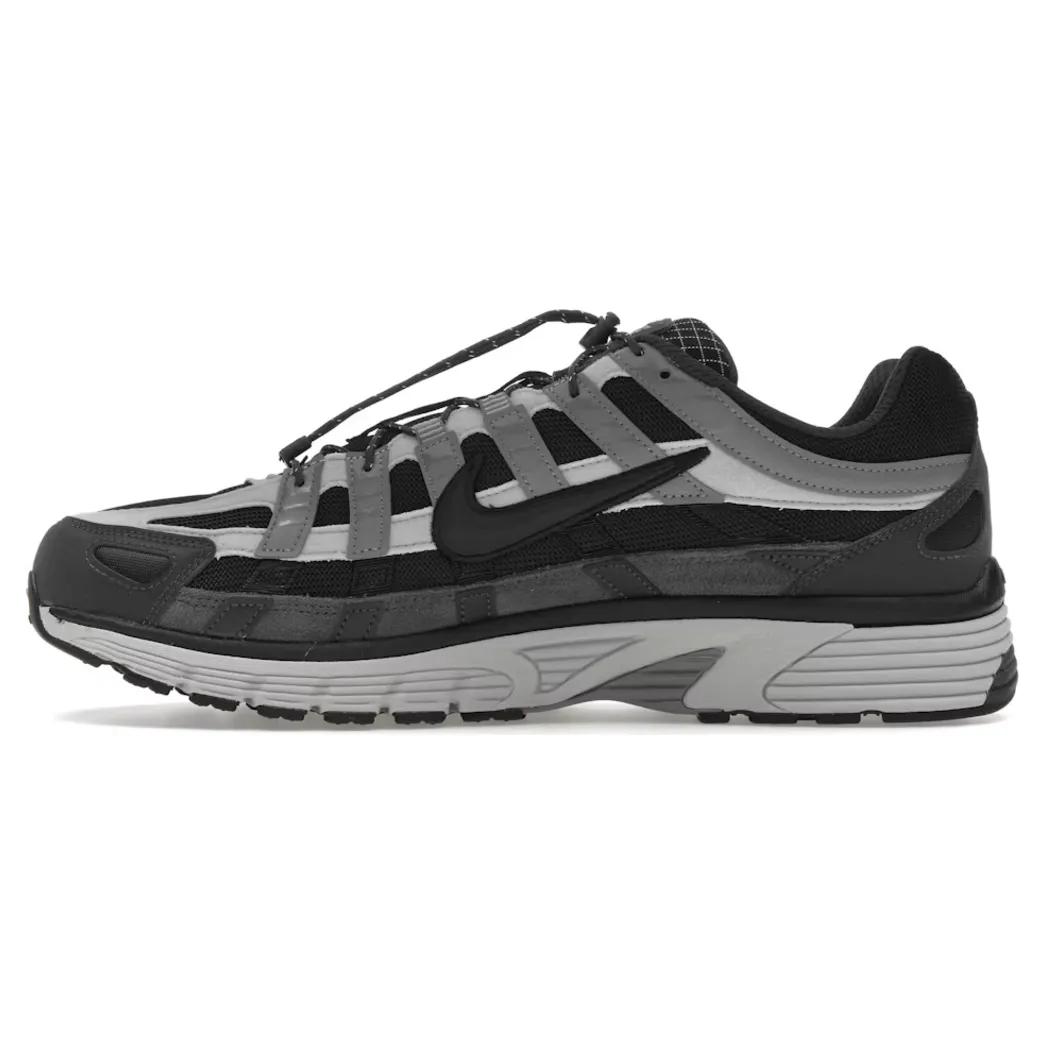 Nike P-6000 Anthracite Smoke Grey Off running in a canal area shoes