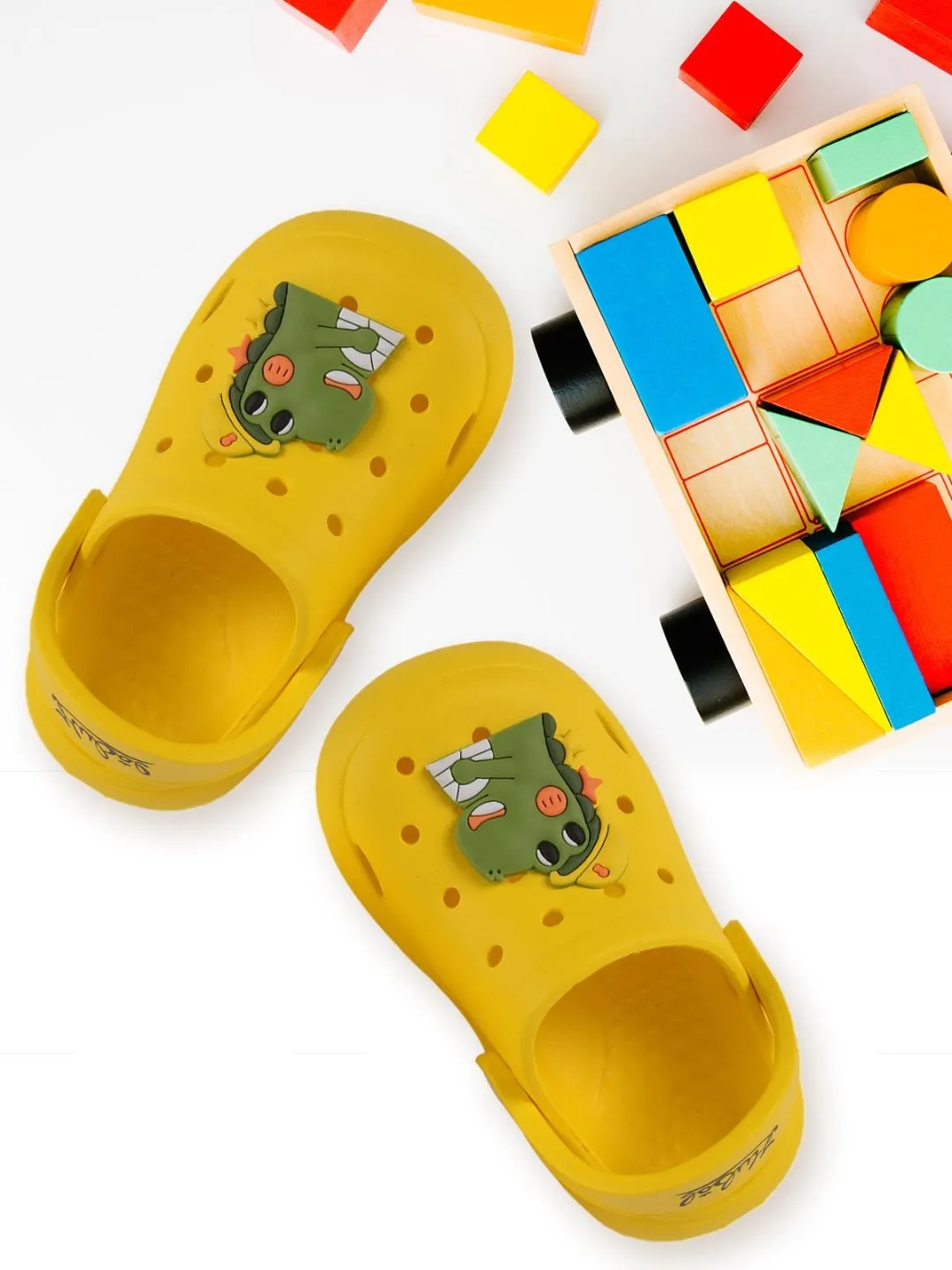 Roaring Adventures Await with Dino Motif Yellow Clogs for Boys!
